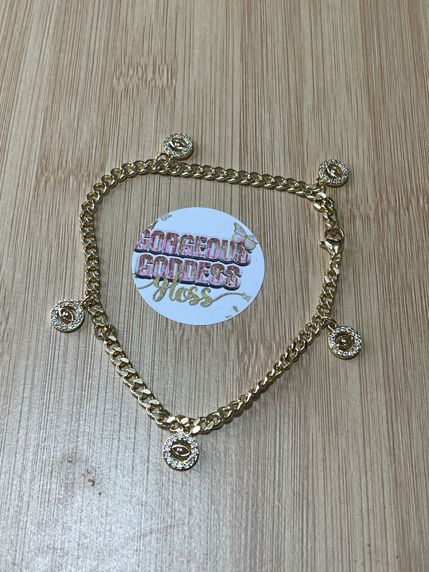 Tiny evil eye circle water resistant anklet